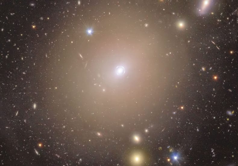 Einstein Ring Surrounds Nearby Galaxy Center Einstein Ring Surrounds Nearby Galaxy Center